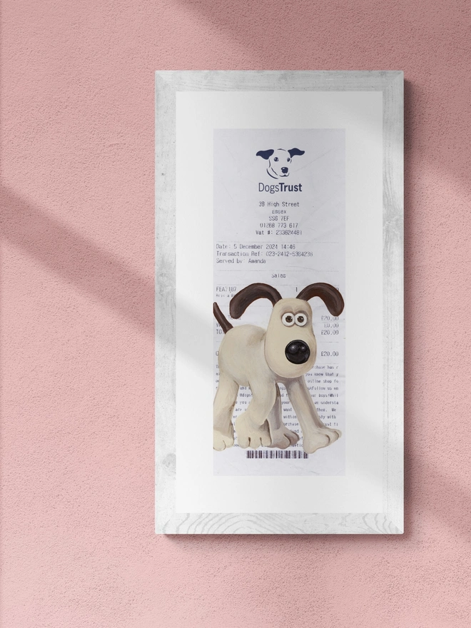 Gromit Dog Trust Receipt Print, against a pink background. 