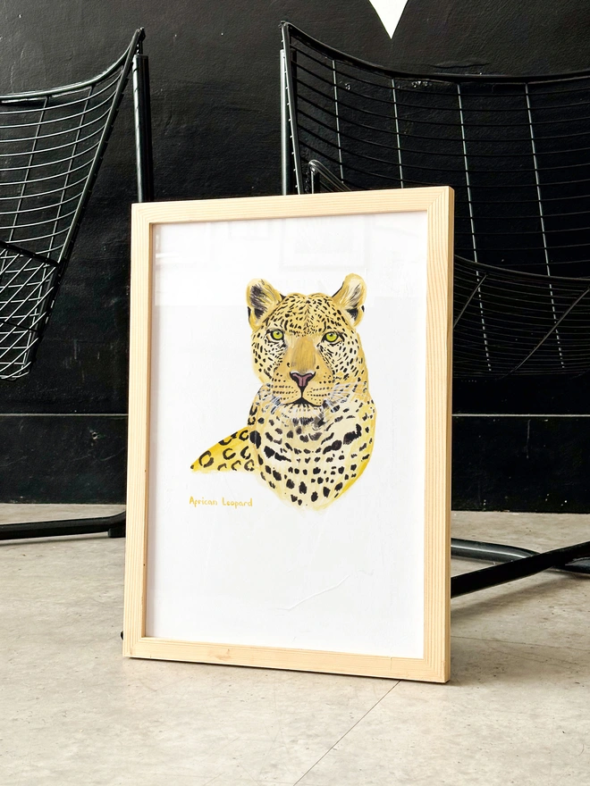 a print featuring an illustration of the head and chest of an african leopard