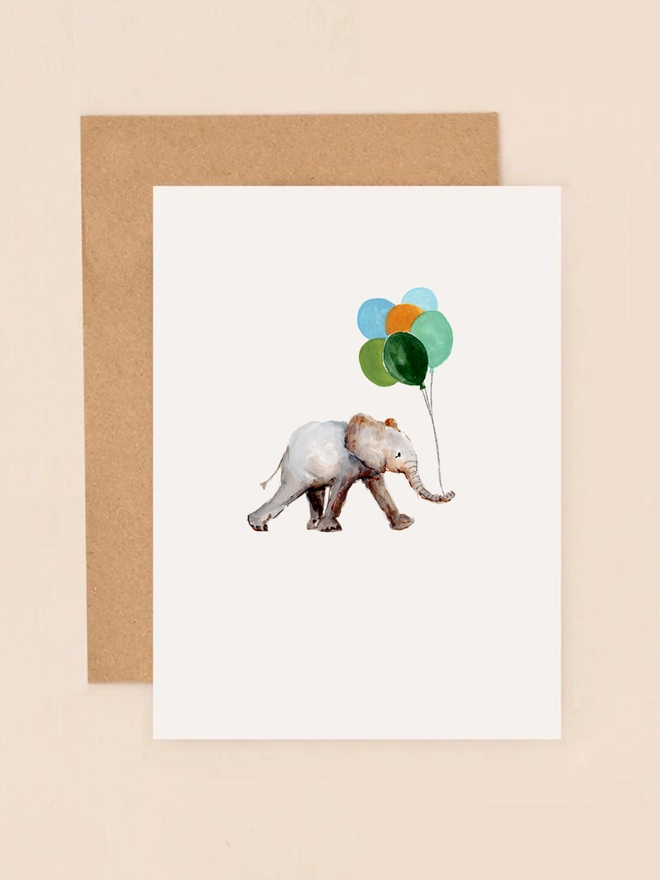 A charming illustration of a joyful elephant holding a cluster of colorful balloons, exuding a sense of celebration and happiness. The elephant's playful stance and the vibrant hues of the balloons create a whimsical and festive atmosphere. The minimalist design and soft background enhance the cheerful mood, making this mini card a delightful choice for birthdays, congratulations, or any occasion that calls for a touch of joy.