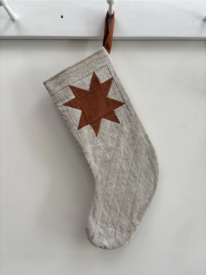 Medium Quilted Linen Star Christmas Stocking in Natural Linen with Rust Linen Patchwork Star Design.