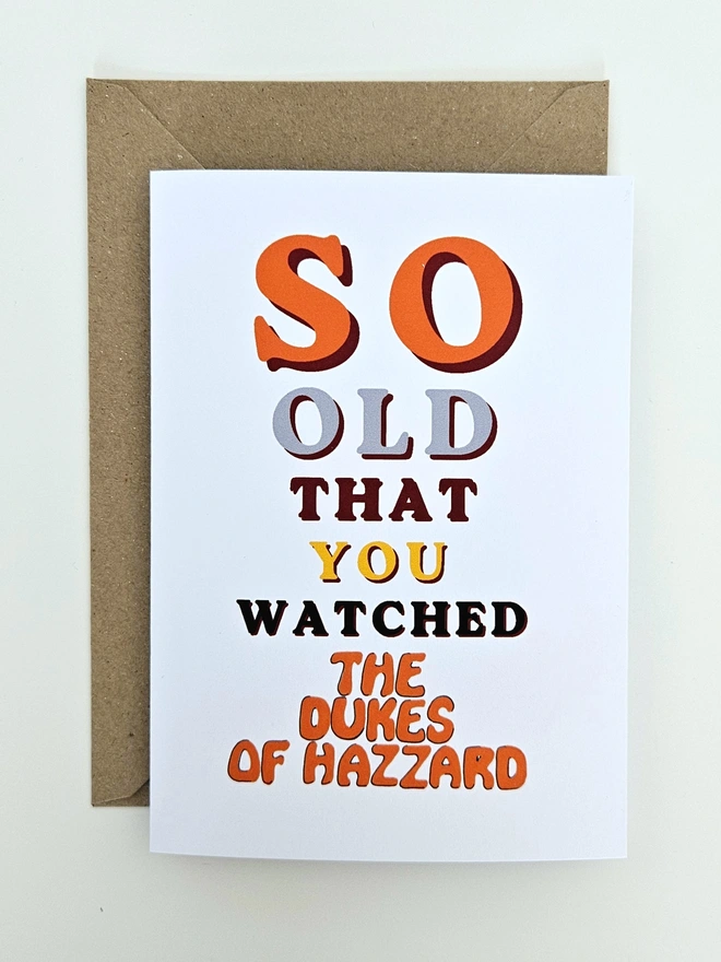 A nostalgic card that says So old that you watched The Dukes of Hazzard in colourful retro style fonts on a white background.