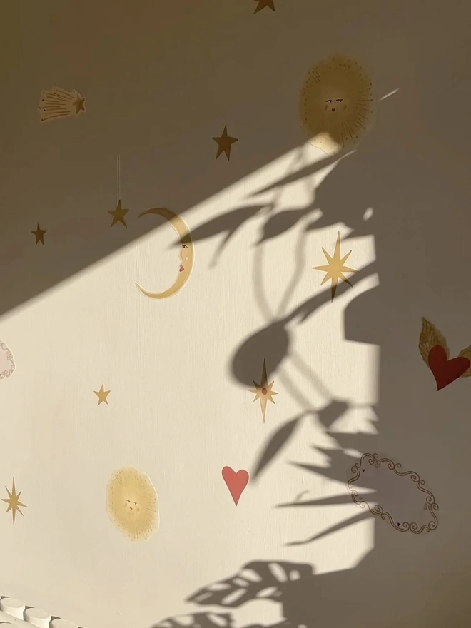 Celestial Dream Fabric Wall Stickers, a wall decorated with colourful wall stickers. 