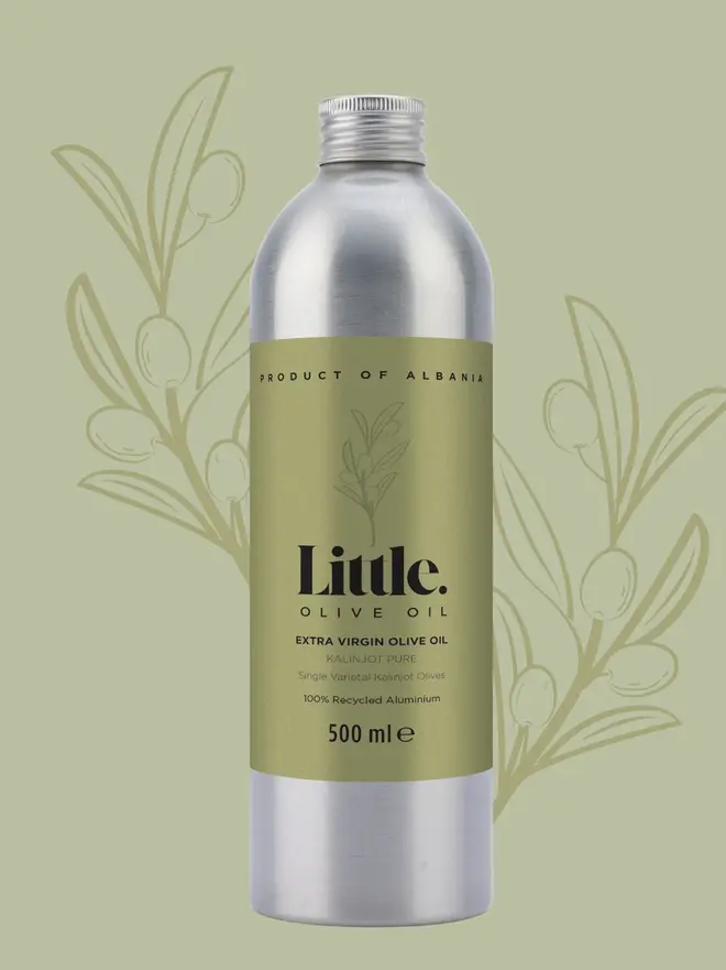 aluminum bottle of olive oil on green background
