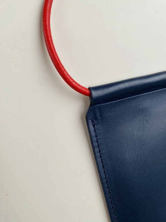 Leather phone bag with colourful strap