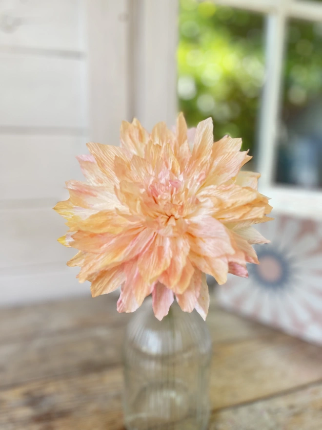 Soft Pink & Orange Dahlia Crepe Paper Flower in a glass bottle vase