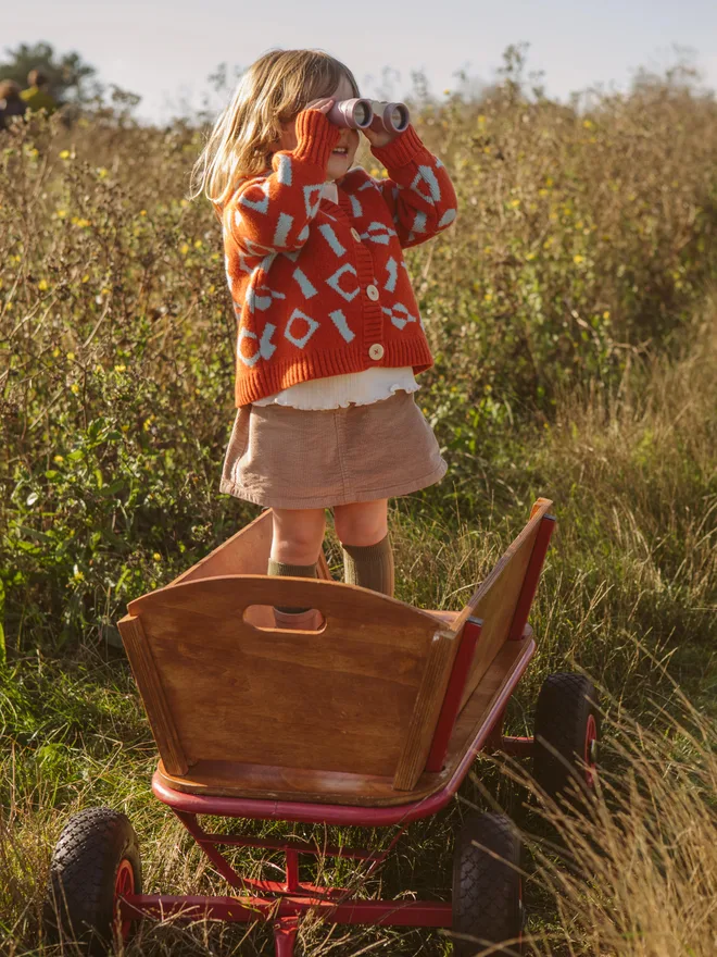 girl in wool cardigan on trailer