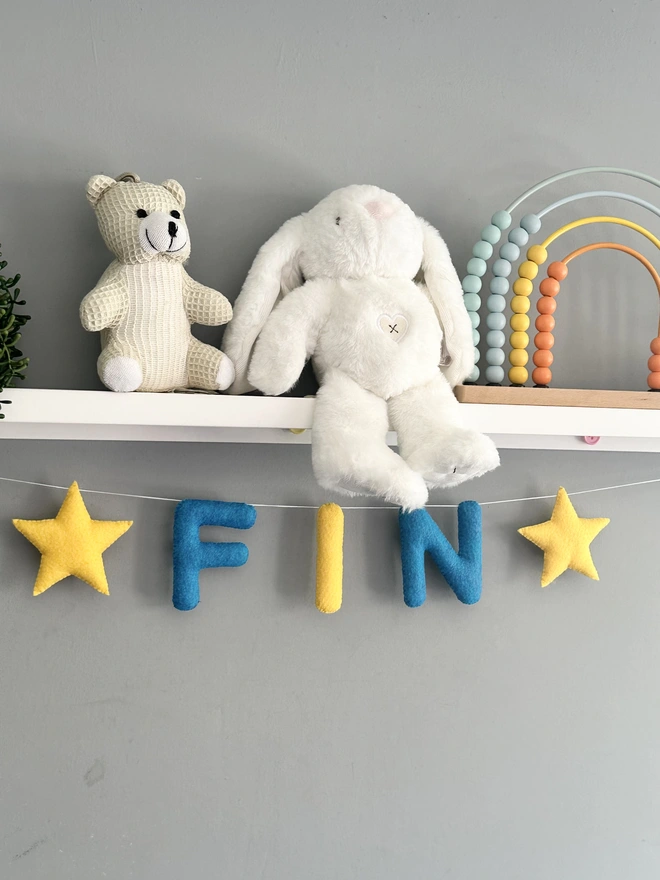 Personalised Name Garland with Stars, a colourful name garland in a child’s bedroom, baby gift, kids bunting 