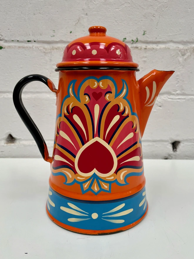 Vintage orange coffee pot, hand-painted with a traditional fairground design in pink, red and blue.