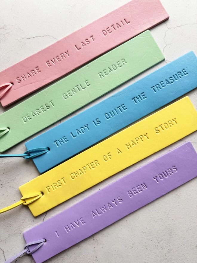 Pastel painted leather bookmark with Bridgerton quotes.