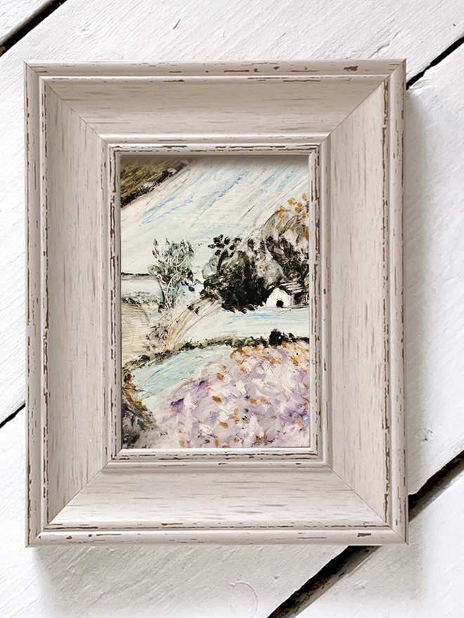 framed landscape drawing in pastel hues
