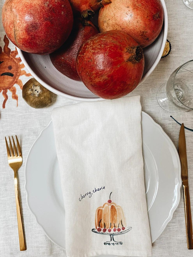 cherry cake print linen napkin lifestyle shot