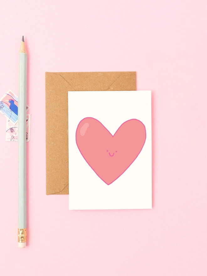 Sweet mini card featuring a smiley love heart. Perfect for anniversaries, valentines, or just to say 'I love you'.