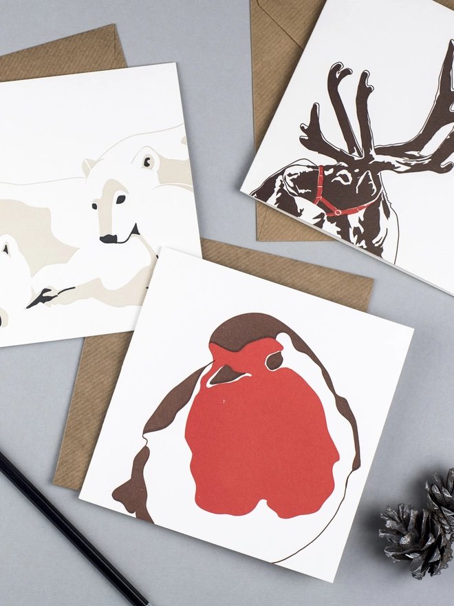 Three of the Christmas collection showing polar bears, robins and reindeer with envelopes all plastic free