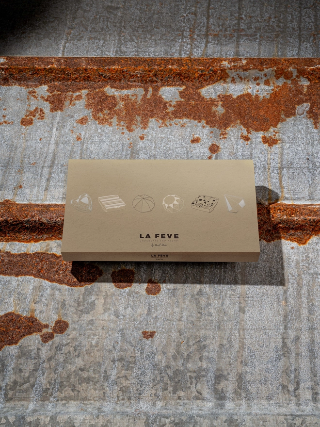 our brown eco-friendly chocolate box with graphics and logo
