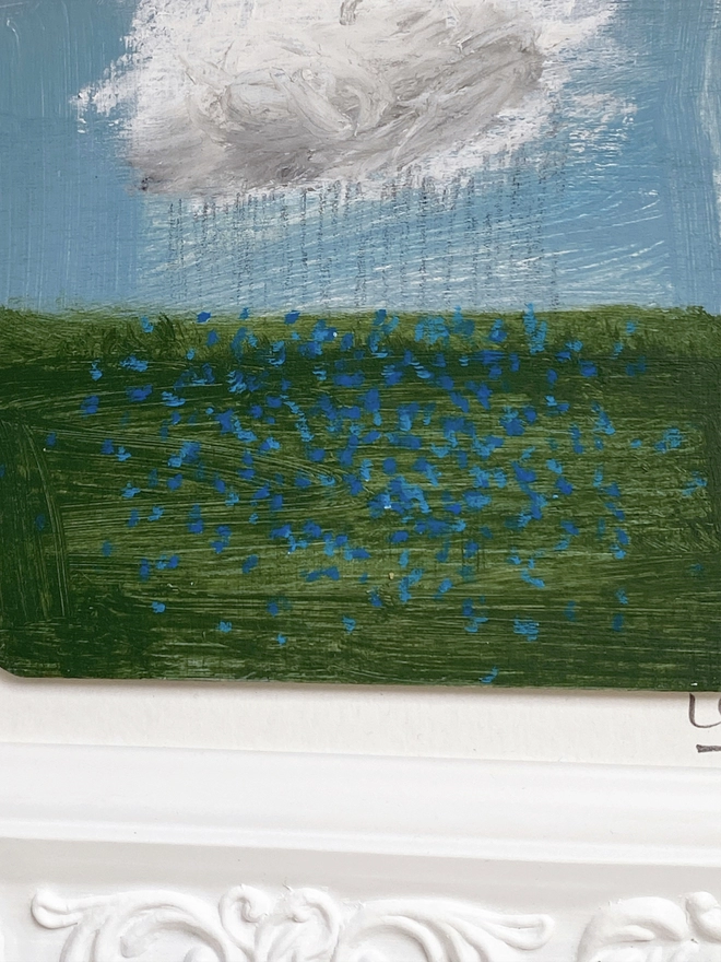 detail of painting of blue sky, a cloud and a field of blue forget-me-nots 