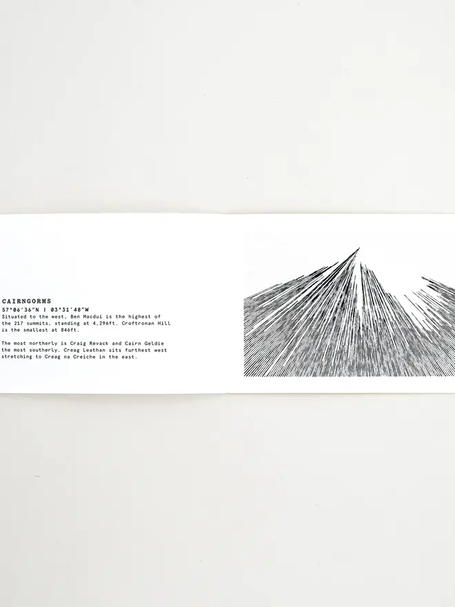 Mountain Book, positioned open on a table