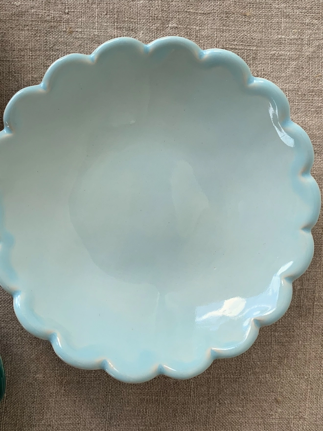 top view of scallop edge ice cream bowl in light blue