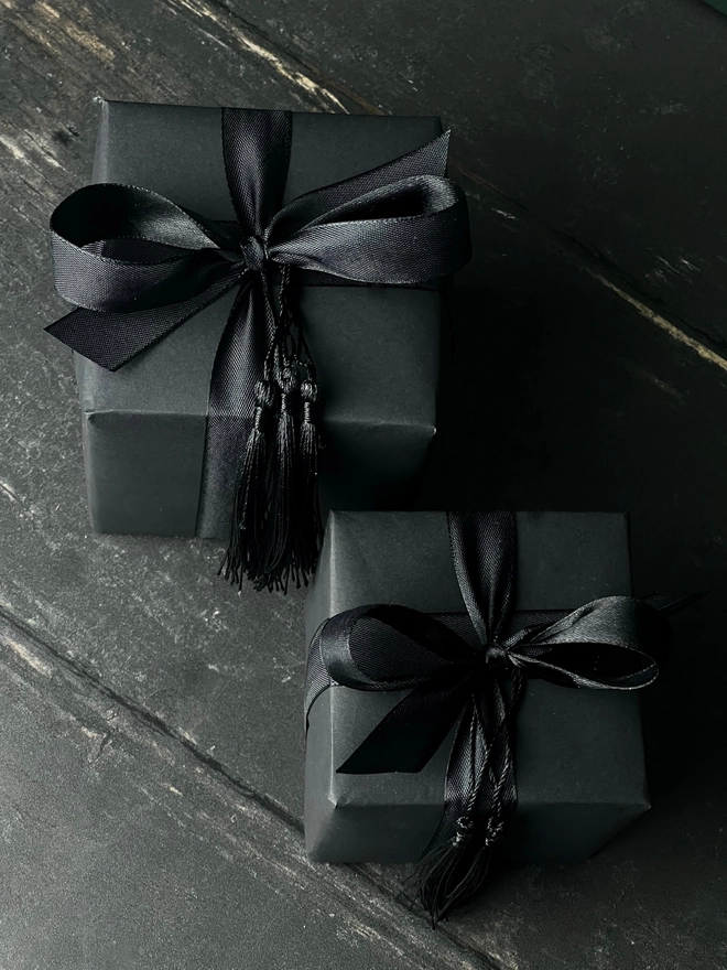 manchego cheese candle. a. black gift box with gift wrap.