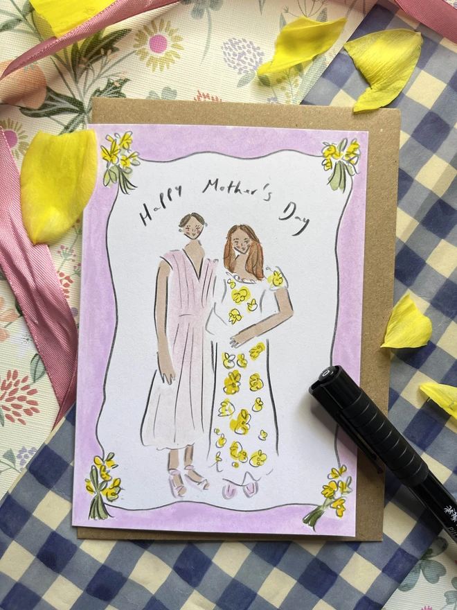 Mother's Day card featuring a portrait of a mother and daughter with a border of tulips and soft purple. A6 card with envelope