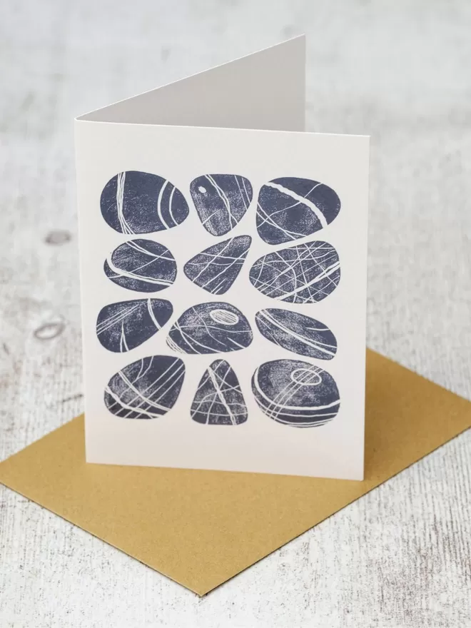 Greeting Card with an image of a Dozen Cornish Pebbles, taken from an original lino print