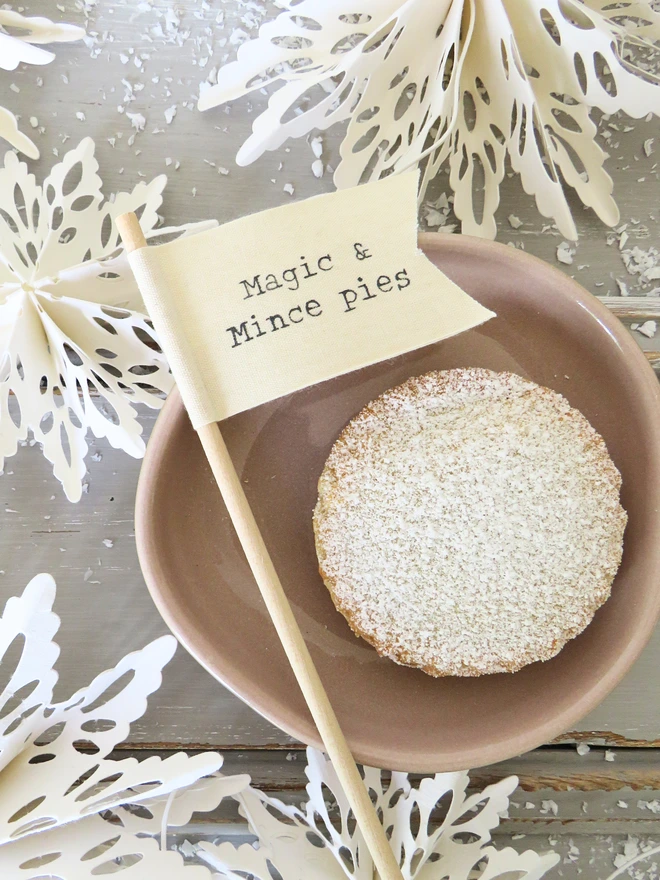 Organic Cotton flag hand painted with festive message wrapped around wooden dowel