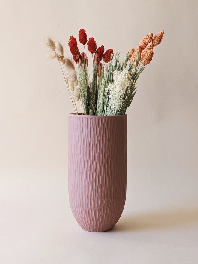 handmade textured pink vase with dried flowers