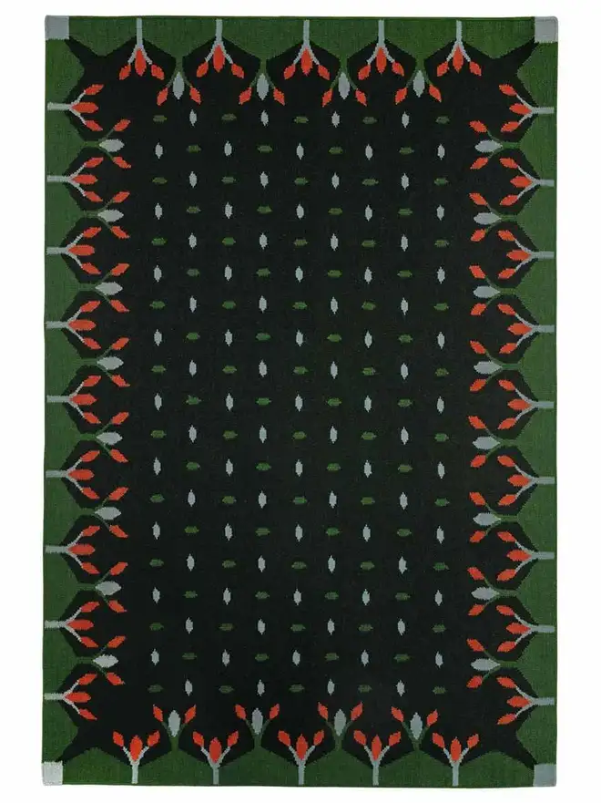 Hedgerow Flatweave Rug, a colourful rug sitting on a plain backdrop. 