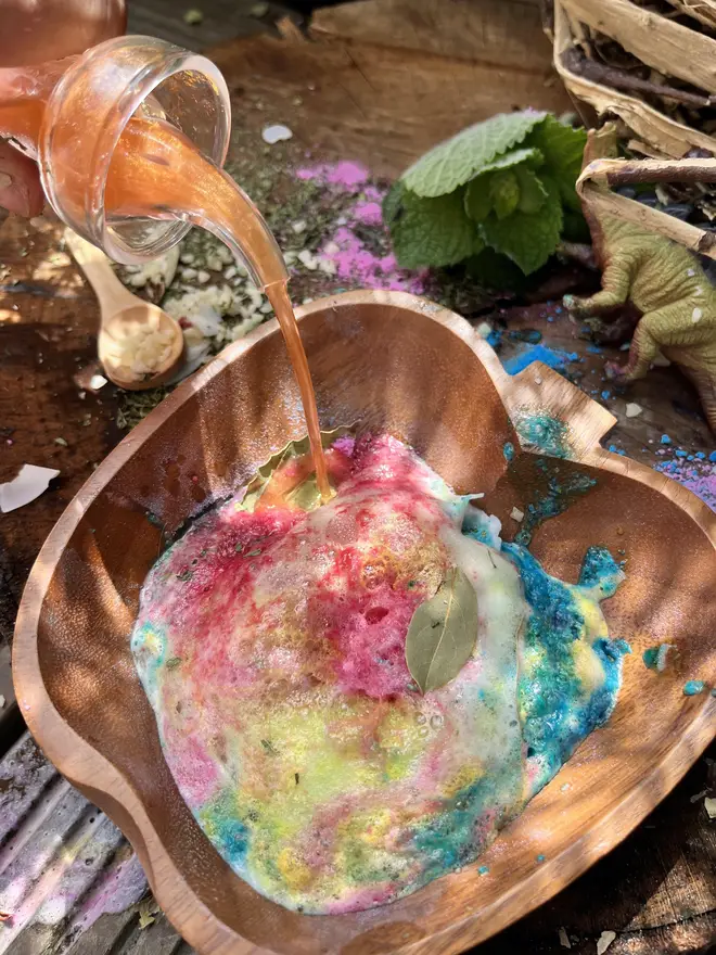 Dino potion action shot - pouring of "lava" making a colourful potion