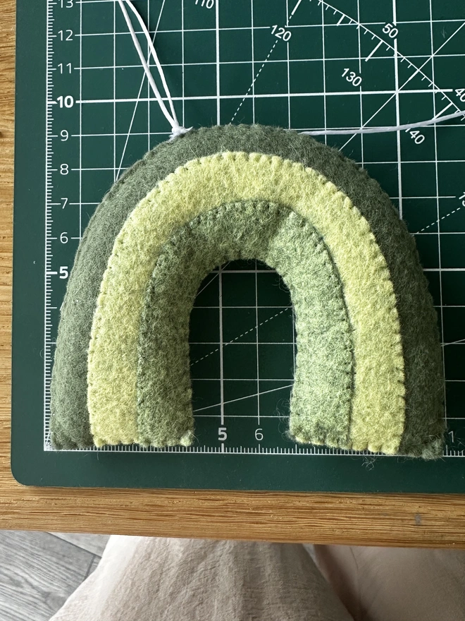 Personalised Name Icon Garland, a child’s name banner hanging from a white shelf, nursery decoration, baby gift 
