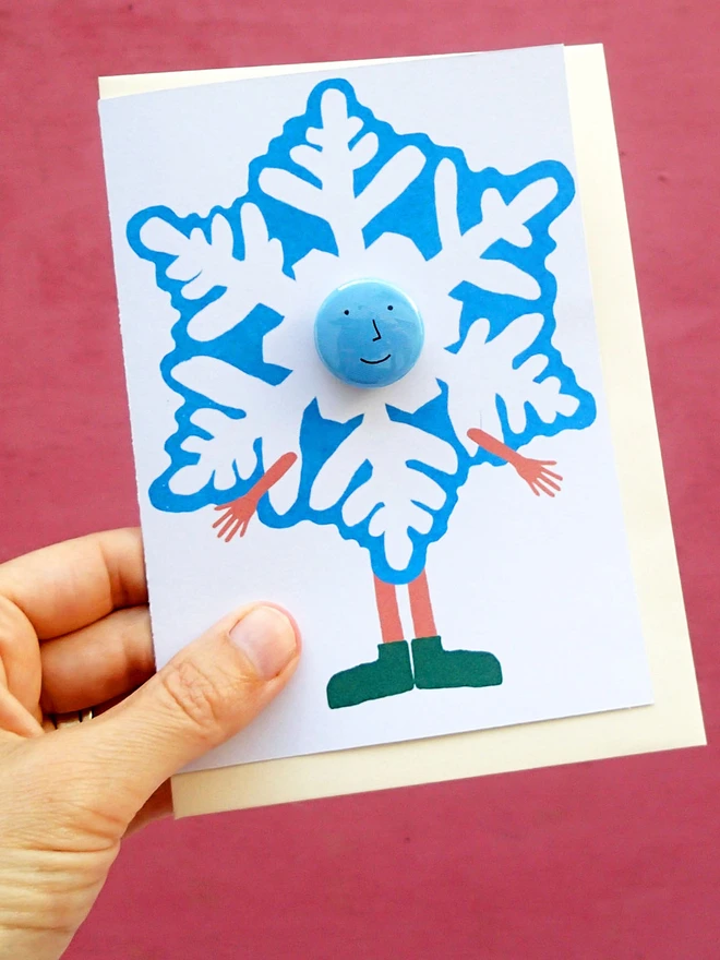 snowflake costume christmas greeting card with pin badge