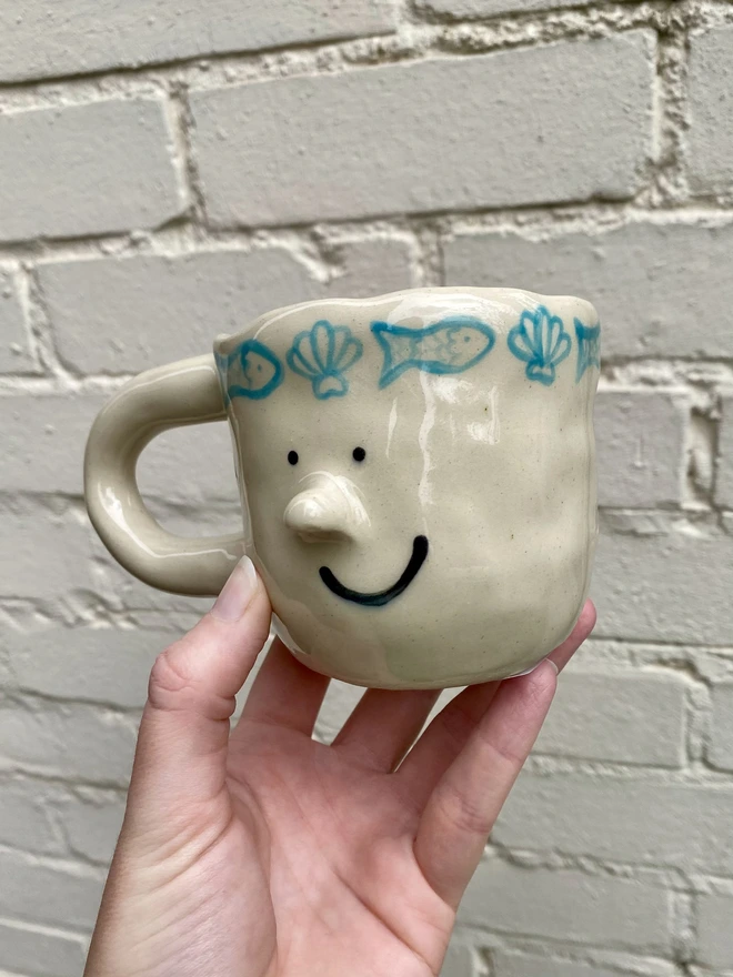 fish and shell mug
