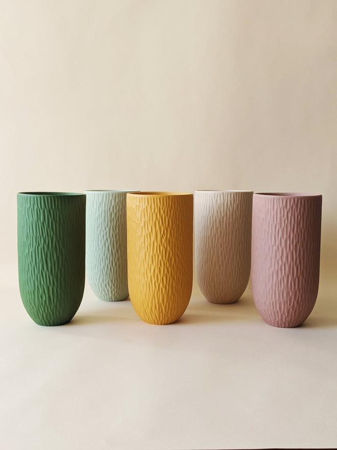 assorted colour handmade textured vases