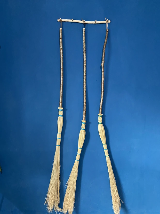 Three handmade cobweb brooms