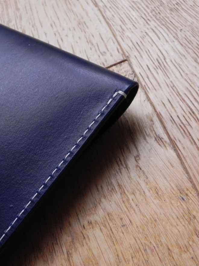 Cream stitching on leather document case