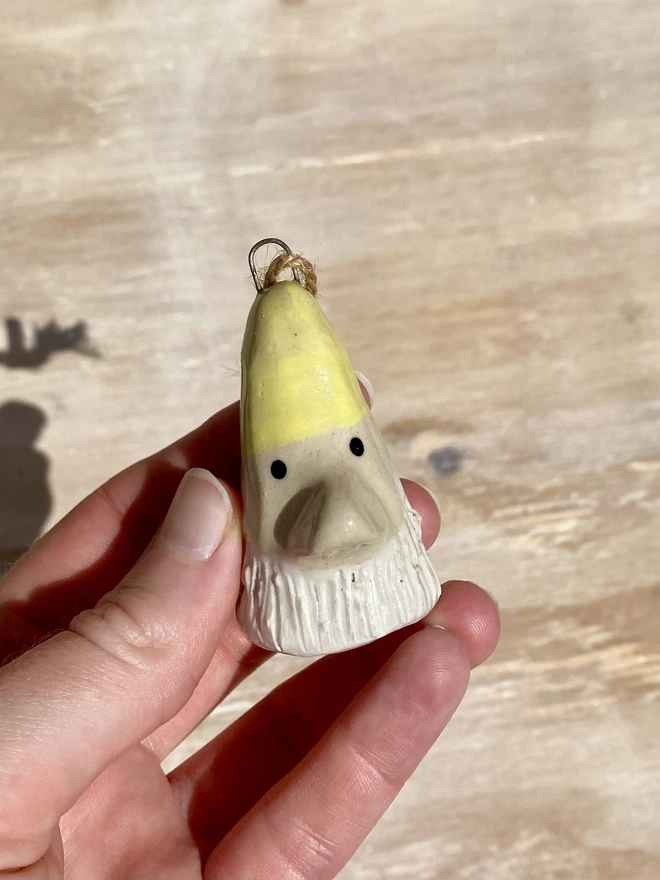 yellow ceramic gnome hanging decoration