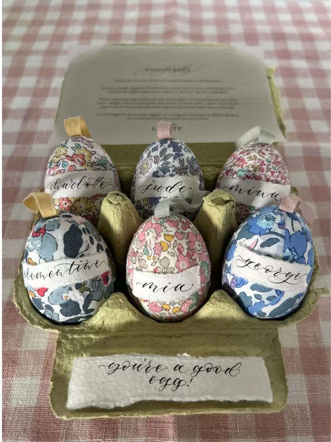 Half a dozen personalised Liberty fabric decorative eggs in egg carton