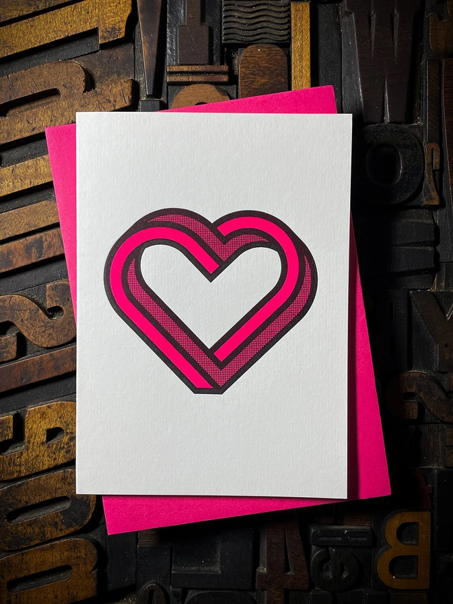 Valentine! A beautiful infinity heart monogram letterpress card printed with rich fluorescent pink ink on thick Pristine White card with a luxury matching envelope; ideal to send a to a friend or loved one.