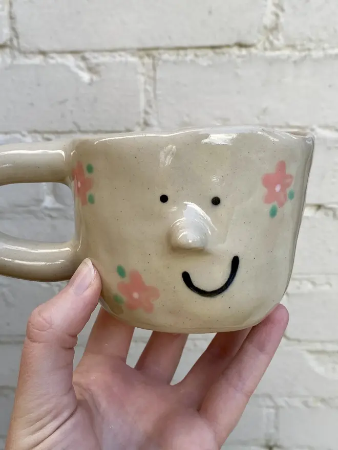 pink flower painted handmade ceramic smiley face mug