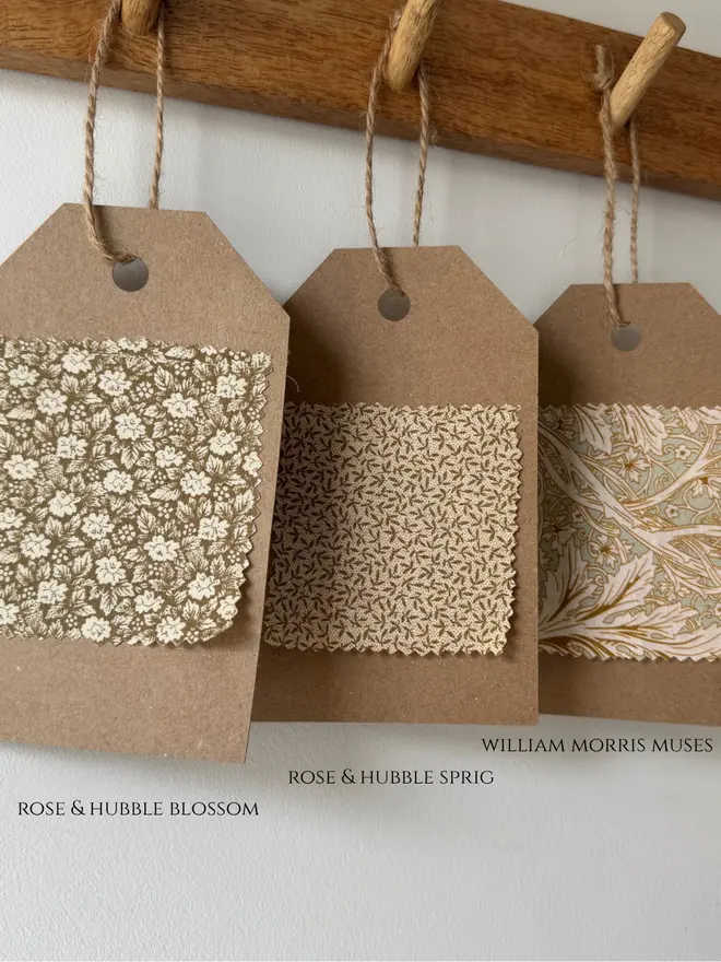 Fabric swatches of green and gold pattered florals