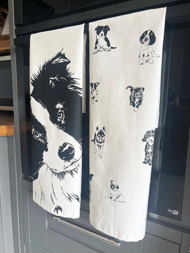Fold Collie tea towel next to the multi dog tea towel 