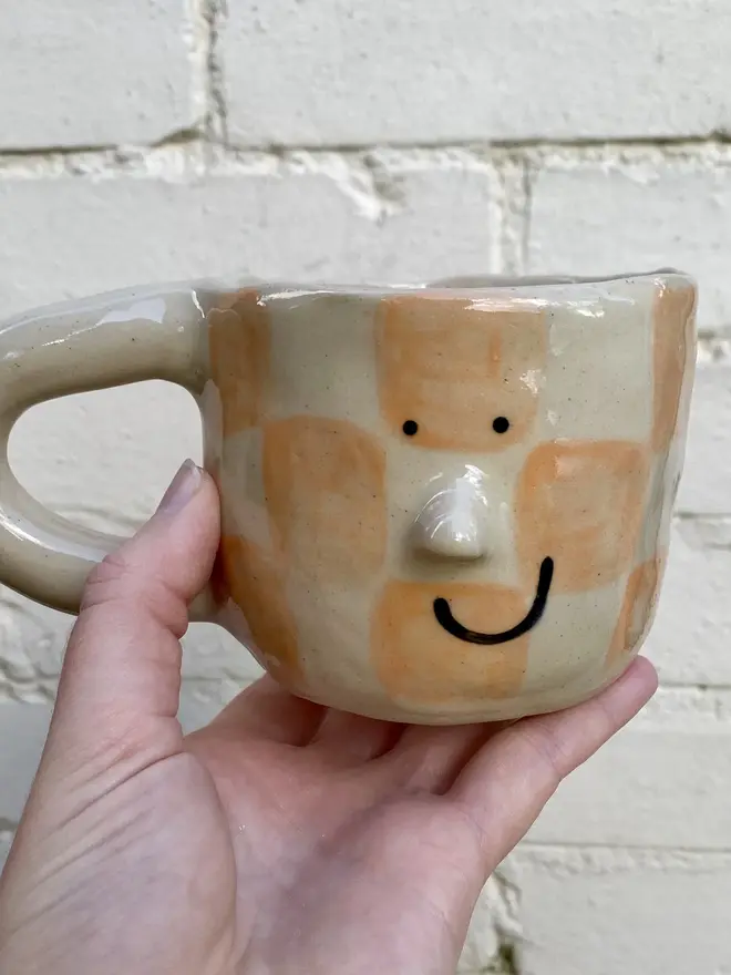 peachy checked handmade ceramic smiley face mug