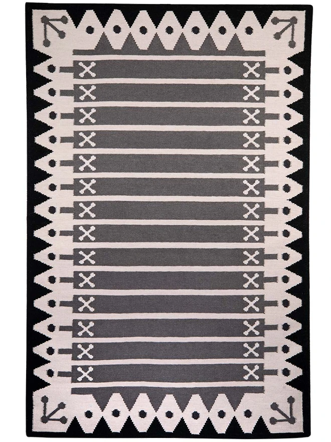 Darjeeling Flatweave Rug, a colourful rug on a plain surface. 