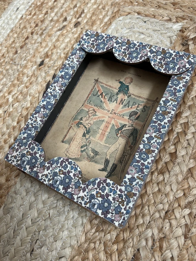 Liberty fabric covered mount frame with scallop edge and Jackanapes print inside