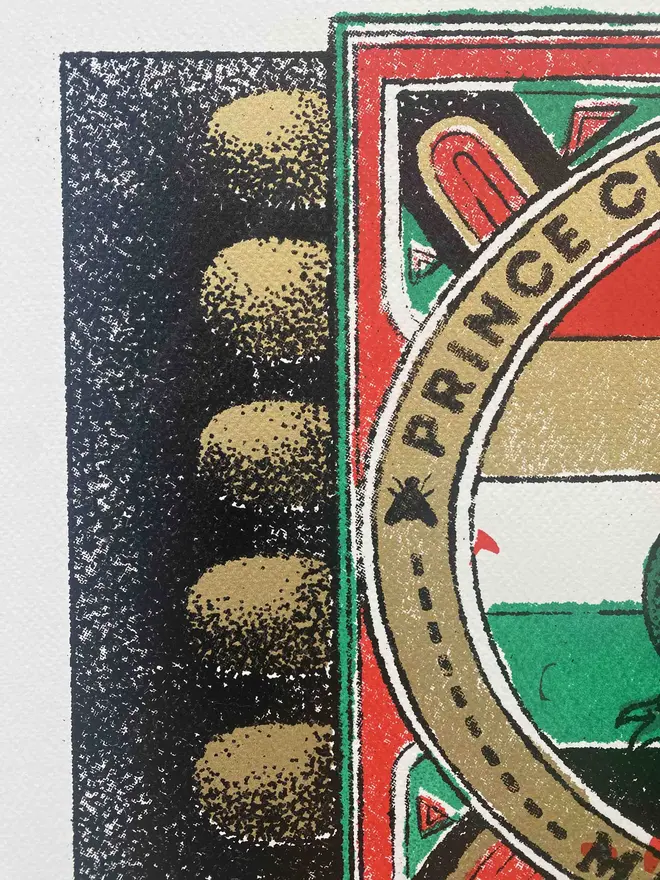  An image of a limited edition A2 screenprint. The print depicts a retro-style matchbox illustration with a central image of a green frog with a white belly, set against a background of horizontal red, white, and green stripes. The frog is framed by a gold-bordered oval. Text at the top of the oval reads "PRINCE CHARMING SAFETY MATCHES," and at the bottom, "MADE IN FOLKESTONE." The matchbox border is red with ornate details and a green trim. The match tips on the left are a textured gold. Below the main image, the print is signed and numbered 5/11. The entire image has a grainy texture, characteristic of a vintage screenprint.