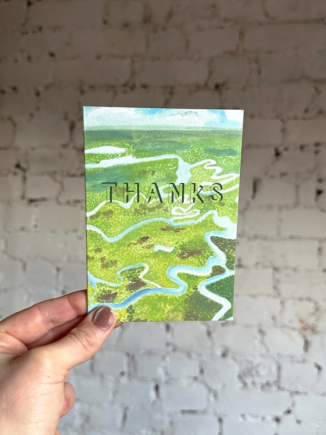 a greetings card featuring an illustration of the everglades landscape with the text “thanks”