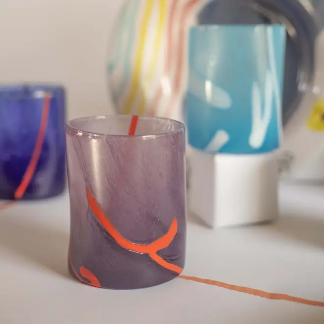 group shot of a blue tumbler and purple tumbler