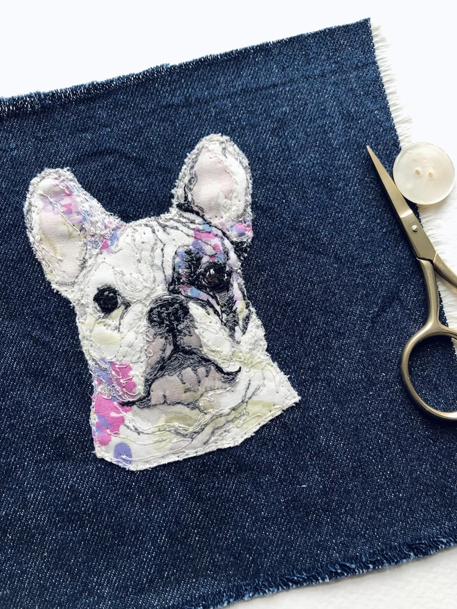 embroidered pet portrait of a white bulldog with pink and purple flowers