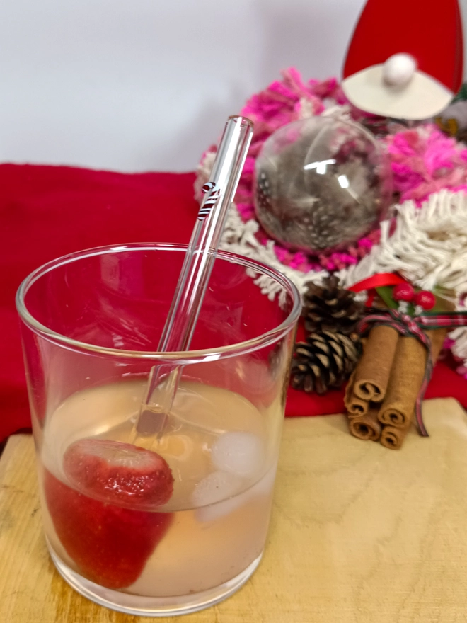 short candy cane straw in a glass