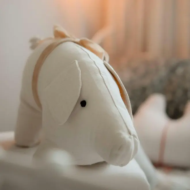 Plush Pig Stuffed Cotton Animal Toy, a stuffed pig toy in a decorated bedroom. 