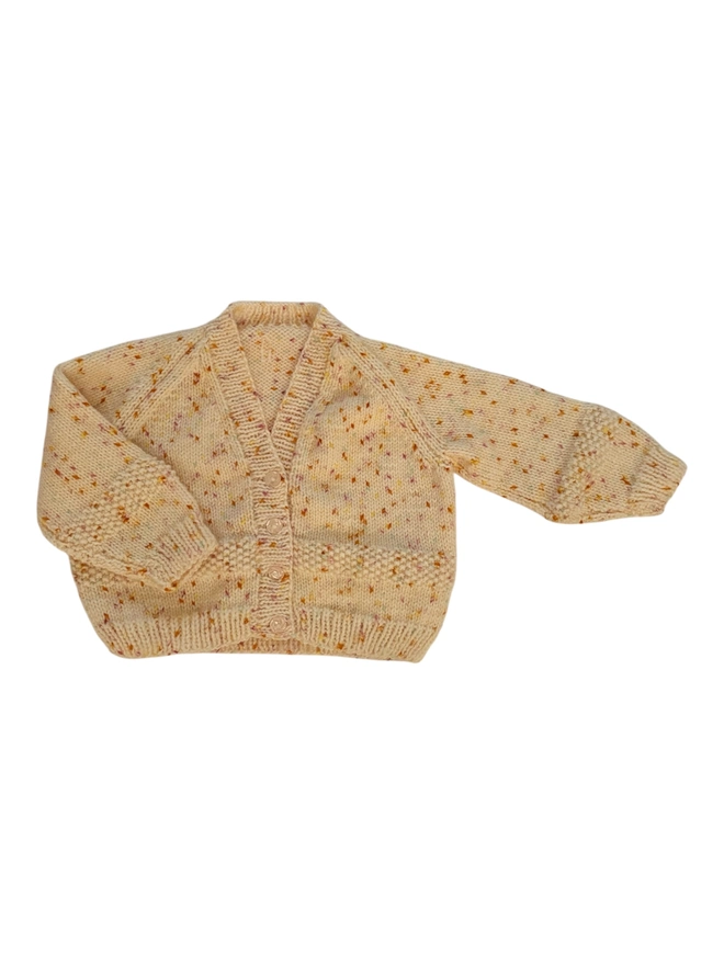 blank knitted cardigan on white backdrop